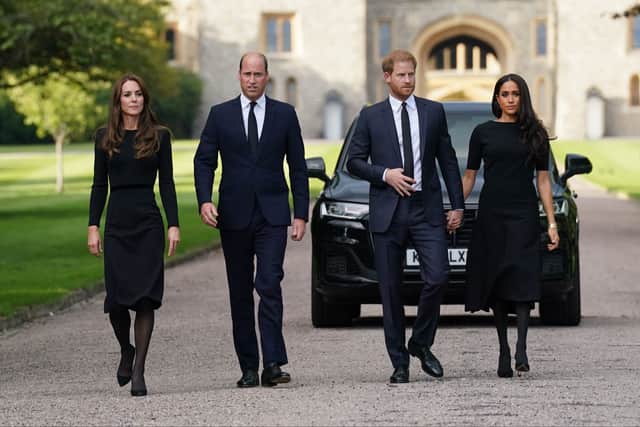 Catherine, Princess of Wales, Prince William, Prince of Wales, Prince Harry, Duke of Sussex, and Meghan, Duchess of Sussex on the long Walk at Windsor Castle on September 10, 2022 in Windsor, England. Crowds have gathered and tributes left at the gates of Windsor Castle to Queen Elizabeth II, who died at Balmoral Castle on 8 September, 2022. (Photo by Kirsty O’Connor - WPA Pool/Getty Images)