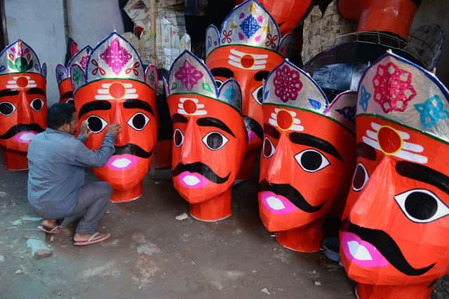 An Indian artist N.Shankar makes effigies of the Hindu demon king Ravana to celebrate the Dushhera-Vijaya Dashami festival at a workshop in Hyderabad, on October 14, 2015.