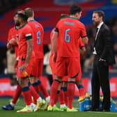 Gareth Southgate, Manager of England speaks with Harry Maguire of England during the UEFA Nations League League A Group 3 match between England and Germany at Wembley Stadium on September 26, 2022 in London, England. 