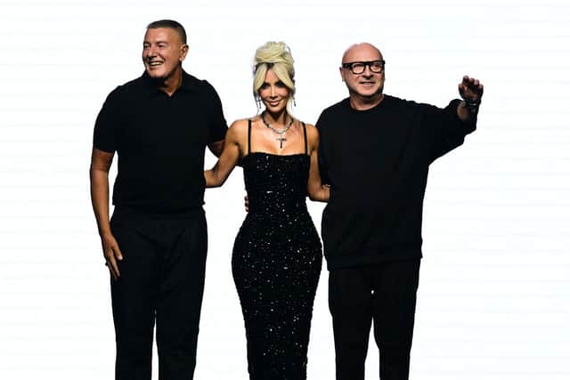 Italian fashion designers Domenico Dolce (R) and Stefano Gabbana with Kim Kardashian at the 2022 Fashion Week in Milan. (Photo by MIGUEL MEDINA/AFP via Getty Images)