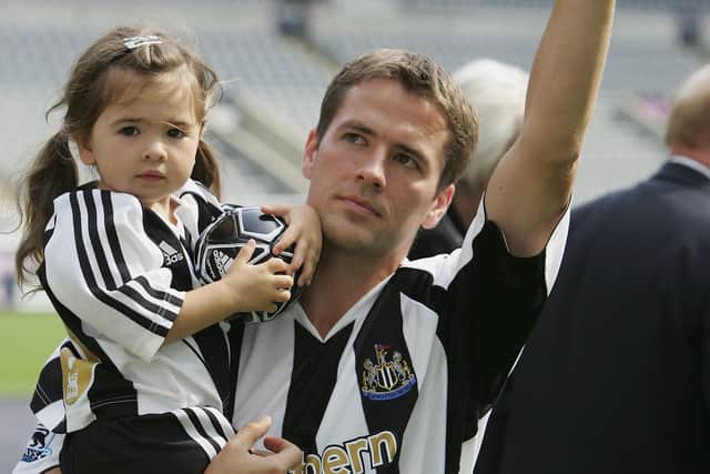 Newcastle United's new signing Michael Owen carries his daughter, Gemma, as he is introduced to the fans at St James' Park on August 31, 2005 in Newcastle, England.  (Photo by Alex Livesey/Getty Images)