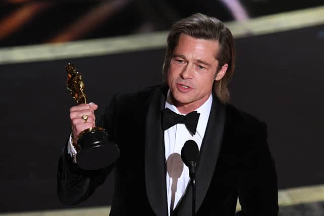 Brad Pitt accepts the Actor in a Supporting Role award for ‘Once Upon a Time...in Hollywood’ onstage during the 92nd Annual Academy Awards (Photo by Kevin Winter/Getty Images)