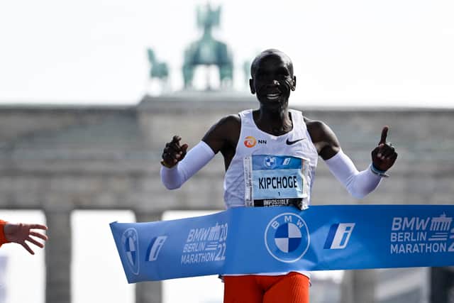 Kipchoge celebrates after beating his own world record by 30 seconds in Berlin
