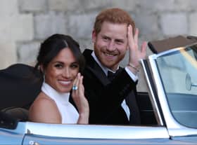 Duchess of Sussex and Prince Harry, Duke of Sussex wave as they leave Windsor Castle after their wedding to attend an evening reception at Frogmore House, hosted by the Prince of Wales on May 19, 2018 in Windsor, England. (Photo by Steve Parsons - WPA Pool/Getty Images)