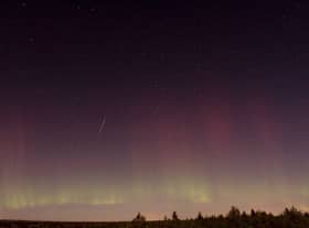 View of a Draonid meteor shooting star and the Northern Lights 150 kilometers north of Stockholm (Photo: SCANPIX SWEDEN/AFP via Getty Images)
