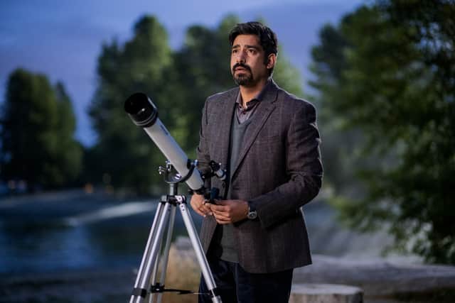 Rahul Kohli as Vincent in The Midnight Club, a telescope set up in front of him (Credit: Eike Schroter/Netflix)