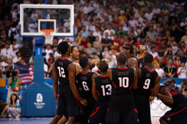 The 2008 US Olympic Men’s Basketball team celebrating, with a basketball hoop in the background (Credit: Netflix/IOC/John Huet)