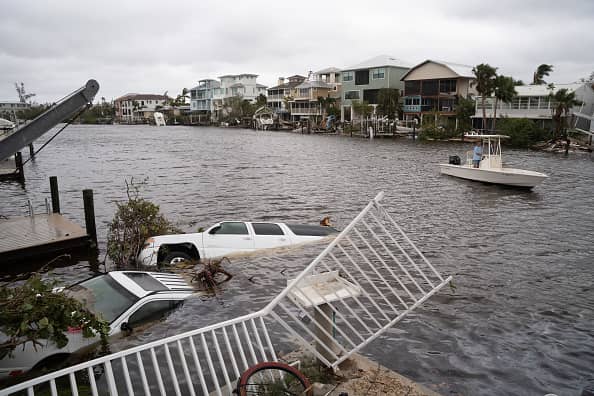Vehicles float in the water after Hurricane Ian (Getty Images)