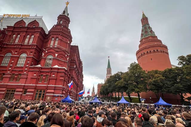 People crowd at Manezhnaya Square in central Moscow for a rally and a concert marking the annexation of four regions of Ukraine (Pic: AFP via Getty Images)
