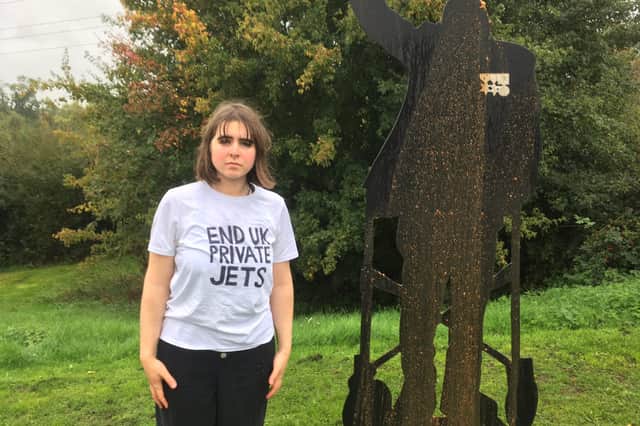 End UK Private Jets supporter Maddie Budd poured human faeces on the Captain Tom memorial (Photo: End UK Private Jets)