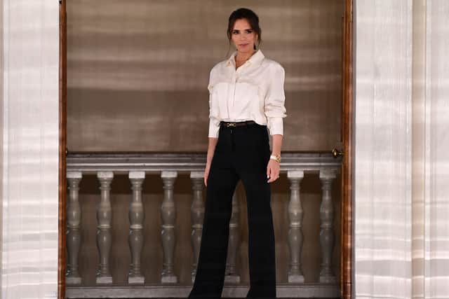 British fashion designer Victoria Beckham reacts after presenting creations for her Autumn/Winter 2020 collection on the third day of London Fashion Week in London on February 16, 2020. (Photo by Daniel LEAL / AFP) (Photo by DANIEL LEAL/AFP via Getty Images)