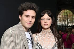 Brooklyn Beckham and Nicola Peltz attended Victoria Beckham’s Paris Fashion Week show despite the ongoing family feud