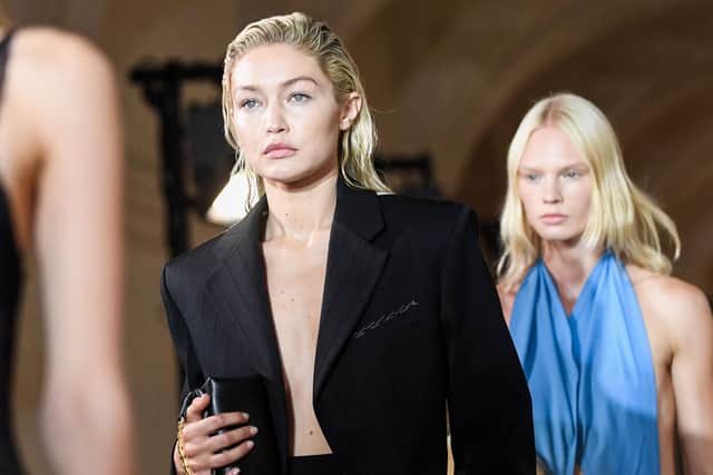 US model Gigi Hadid presents a creation for the Victoria Beckham Spring-Summer 2023 fashion show during the Paris Womenswear Fashion Week, in Paris, on September 30, 2022