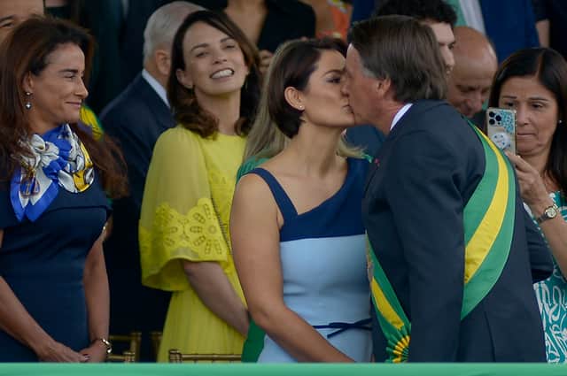 Jair Bolsonaro kisses his wife Michelle Bolsonaro during an Independence parade in September 2022 (Pic: Getty Images)