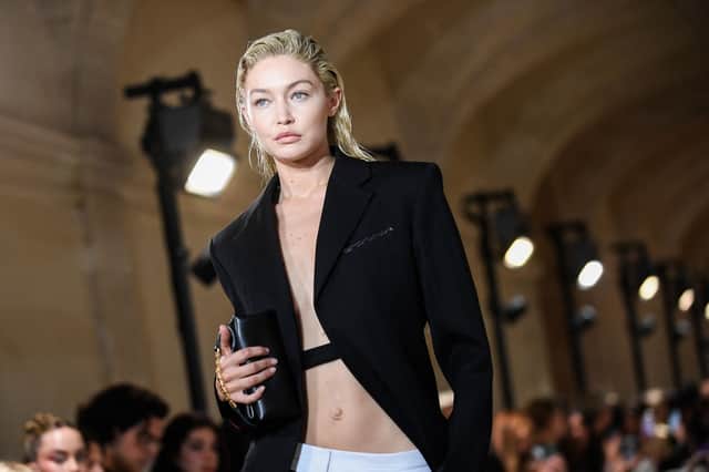 US model Gigi Hadid presents a creation for the Victoria Beckham Spring-Summer 2023 fashion show during the Paris Womenswear Fashion Week, in Paris, on September 30, 2022. (Photo by JULIEN DE ROSA / AFP) (Photo by JULIEN DE ROSA/AFP via Getty Images)