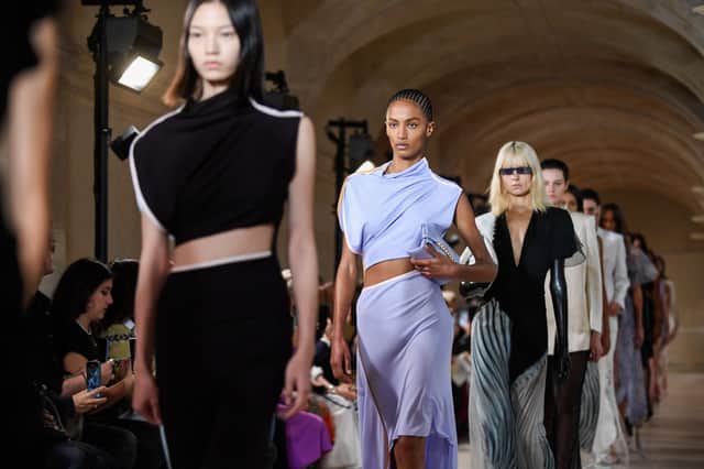 Models present creations for the Victoria Beckham Spring-Summer 2023 fashion show during the Paris Womenswear Fashion Week, in Paris, on September 30, 2022. (Photo by JULIEN DE ROSA / AFP) (Photo by JULIEN DE ROSA/AFP via Getty Images)