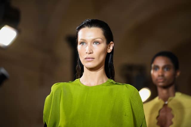 US model Bella Hadid presents a creation for the Victoria Beckham Spring-Summer 2023 fashion show during the Paris Womenswear Fashion Week, in Paris, on September 30, 2022. (Photo by JULIEN DE ROSA / AFP) (Photo by JULIEN DE ROSA/AFP via Getty Images)