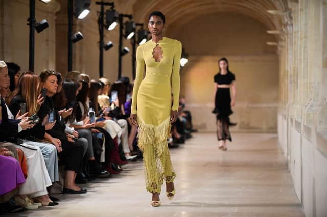 A model presents a creation for the Victoria Beckham Spring-Summer 2023 fashion show during the Paris Womenswear Fashion Week, in Paris, on September 30, 2022. (Photo by JULIEN DE ROSA / AFP) (Photo by JULIEN DE ROSA/AFP via Getty Images)