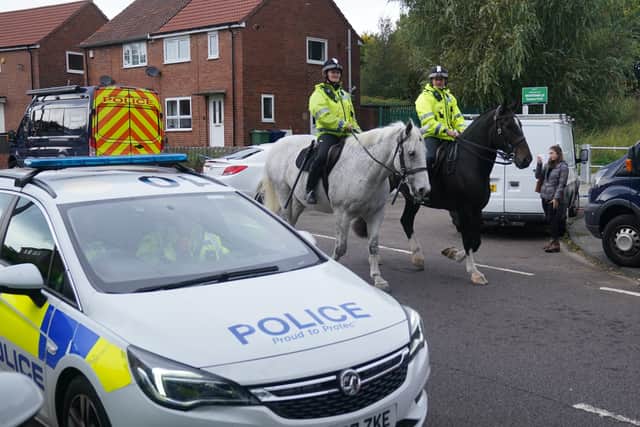 Mounted police patrol the area close to the scene on Aycliffe Crescent, Gateshead. Credit: PA