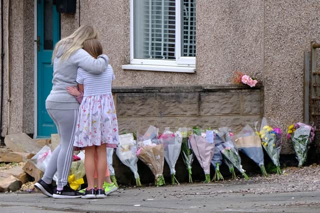 Floral tributes left at the scene where Sharlotte Naglis died. Credit: SWNS