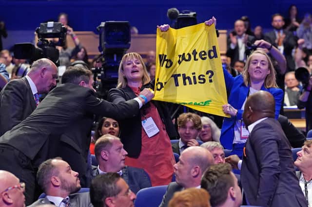 Greenpeace protesters interrupt Prime Minister Liz Truss’s speech during the Conservative Party annual conference. Credit: PA