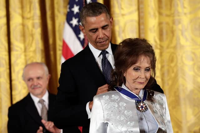 Barack Obama awards the Presidential Medal of Freedom to Loretta Lynn in 2013. (Photo by Win McNamee/Getty Images)