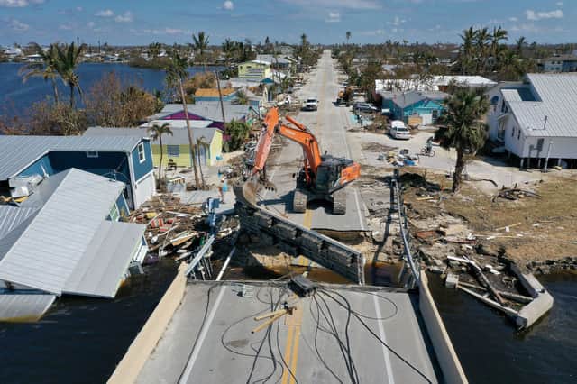 An FDOT crew works on repairing the road that goes to Pine Island on October 04, 2022 in Matlacha, Florida. (Photo by Joe Raedle/Getty Images)