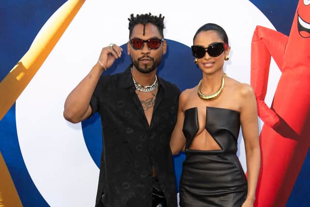Singer Miguel and his wife Nazanin Mandi attend the World Premiere Of Universal Pictures "Nope" at the Chinese theatre in Hollywood, California, July 18, 2022. (Photo by VALERIE MACON / AFP) (Photo by VALERIE MACON/AFP via Getty Images)