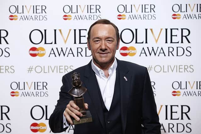 US actor, producer and director Kevin Spacey poses with a special award recognising his contribution to British theatre during his tenure as Artistic Director of The Old Vic during the Lawrence Olivier Awards for theatre at the Royal Opera House in central London on April 12, 2015. (Photo by JUSTIN TALLIS/AFP via Getty Images)