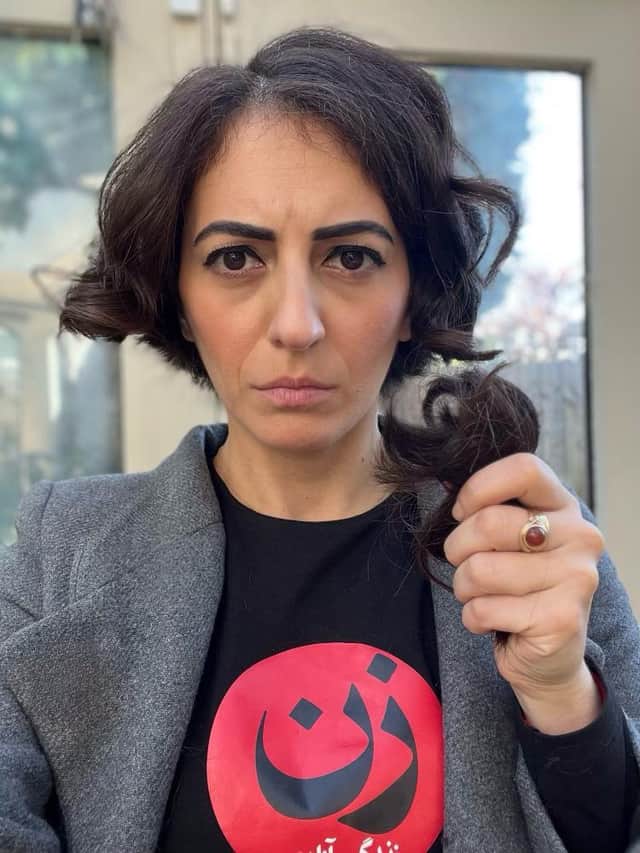Elika Ashoori cut her hair live on television in solidarity with female protesters in Iran. Credit: PA
