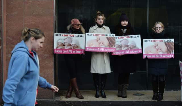 <p>Pro-life activists protest outside an abortion clinic in Belfast (Getty Images)</p>