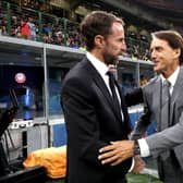 Gareth Southgate, Manager of England shakes hands with Italy Head Coach, Roberto Mancini 
