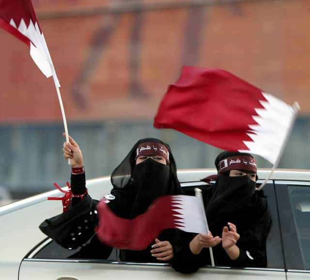 Qatari women wave the flag during celebrations ahead of World Cup 2022