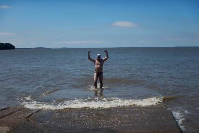 Dad-of-two Phil Warren has become the first person ever to swim across the Bristol Channel using only breaststroke despite suffering with severe hypothermia during the crossing.