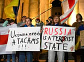 Demonstrators rally to condemn Russian strikes on Ukraine during an event organised by Ukrainian refugees and activists, in Tbilisi. Credit: VANO SHLAMOV/AFP via Getty Images