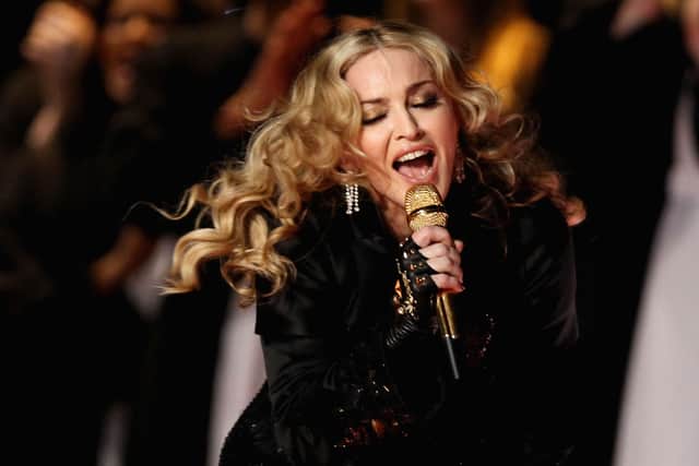 Singer Madonna performs during the Bridgestone Super Bowl XLVI Halftime Show at Lucas Oil Stadium on February 5, 2012