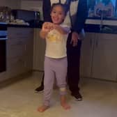 Felicity Edgar, aged 5, who was told she may never walk due to having cerebral palsy has walked unaided for the first time - just days after her dad died.