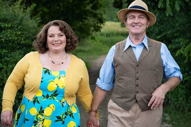 Joanna Scanlan as Ma Larkin and Bradley Walsh as Pop Larkin, holding hands and smiling (Credit: ITV/Objective Fiction/Genial Productions)