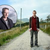 Lewis Gribben as Danny in Somewhere Boy, standing in the middle of a country road. In a circular insert is a picture of Pete Jackson, wearing a thick winter coat (Credit: Channel 4)