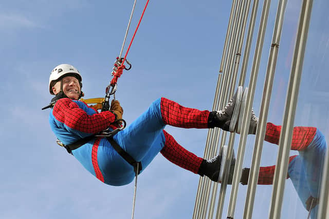 John Caudwell wears a Spiderman suit as he abseils down from the top of the Shard  to raise money for charity on September 03, 2012 in London, England (Photo by John Stillwell - WPA Pool/Getty Images)