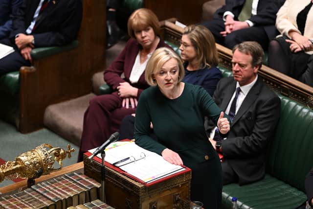Liz Truss said during PMQs she would not reduce public spending - but economists say it is impossible amidst her huge tax cuts. Credit: PA