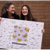 Lowri Moore, who has launched a campaign calling for tech companies to make more emojis with glasses on, with her mum Cyrilyn.