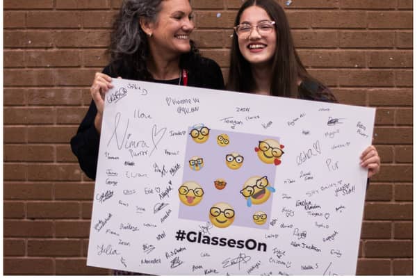 Lowri Moore, who has launched a campaign calling for tech companies to make more emojis with glasses on, with her mum Cyrilyn.