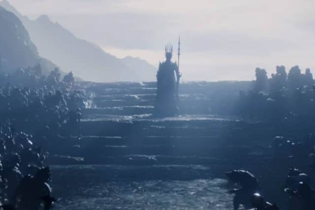 Sauron, in his distinctive spiky armour, ascending stone steps in The Lord of the Rings: The Rings of Power (Credit: Amazon Studios)