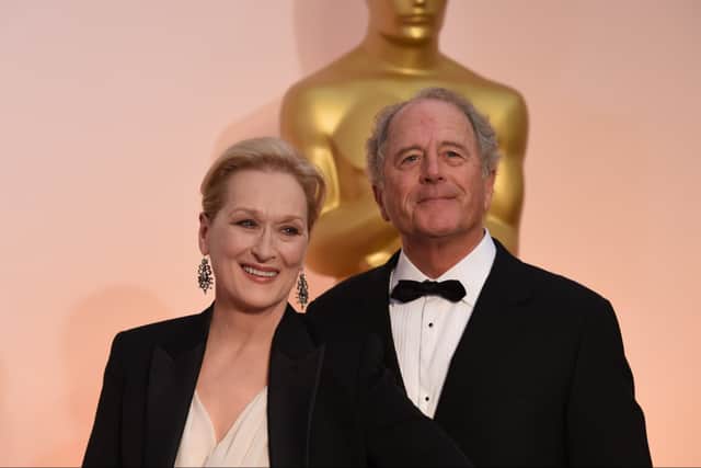 Actress Meryl Streep and Don Gummer pose on the red carpet for the 87th Oscars on February 22, 2015 in Hollywood, California. (Photo credit: MARK RALSTON/AFP via Getty Images)