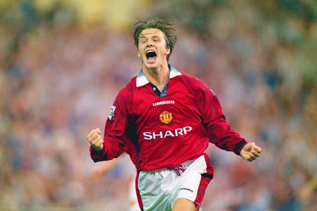 David Beckham of Manchester United celebrates after scoring the third goal in the 1996 FA Charity Shield between Manchester United and Newcastle United at Wembley Stadium on August 11, 1996 in London, England.  (Photo by Shaun Botterill/Allsport/Getty Images)