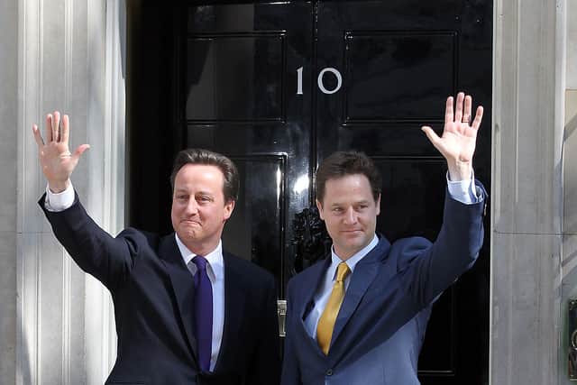 David Cameron welcomes Deputy Prime Minister Nick Clegg to Downing Street for their first day of coalition government on 12 May 2010 (Photo: Matt Cardy/Getty Images)