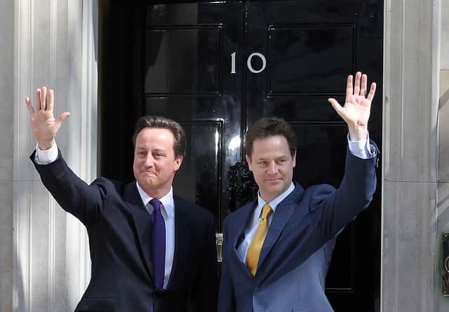 David Cameron welcomes Deputy Prime Minister Nick Clegg to Downing Street for their first day of coalition government on 12 May 2010 (Photo: Matt Cardy/Getty Images)