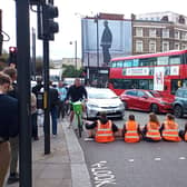 Handout photo issued by Just Stop Oil of protesters blocking Shoreditch High Street in London. Picture date: Saturday October 15, 2022.