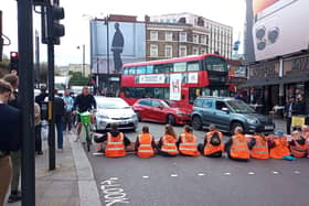 Handout photo issued by Just Stop Oil of protesters blocking Shoreditch High Street in London. Picture date: Saturday October 15, 2022.